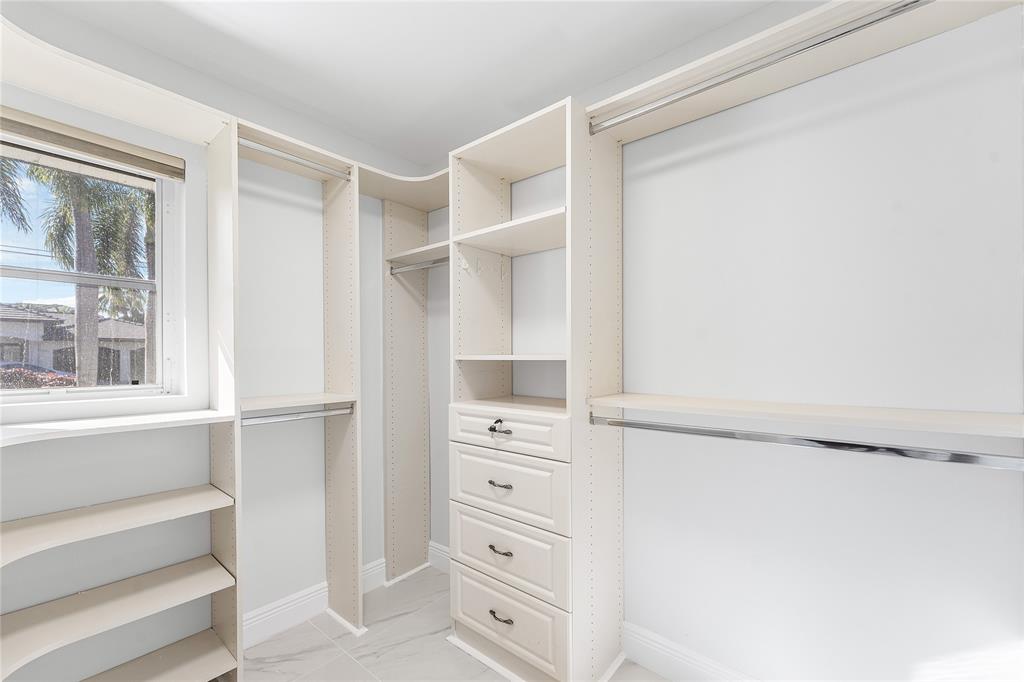 2443 Northeast 26th Street Lighthouse Point, FL 33064 - Photo 26 of 67 a view of an empty walk in closet