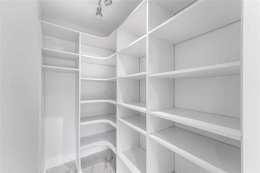 2443 Northeast 26th Street Lighthouse Point, FL 33064 - Photo 31 of 67 a view of an empty walk in closet