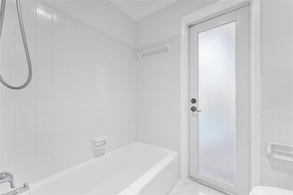 2443 Northeast 26th Street Lighthouse Point, FL 33064 - Photo 33 of 67 a bathroom with a bathtub