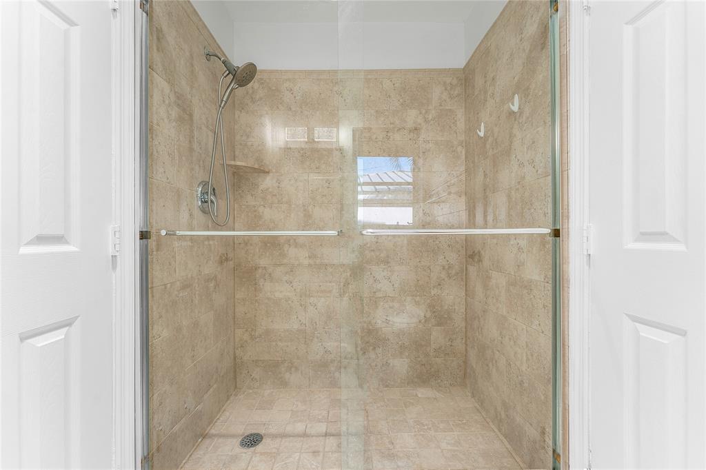 2443 Northeast 26th Street Lighthouse Point, FL 33064 - Photo 40 of 67 a bathroom with a shower