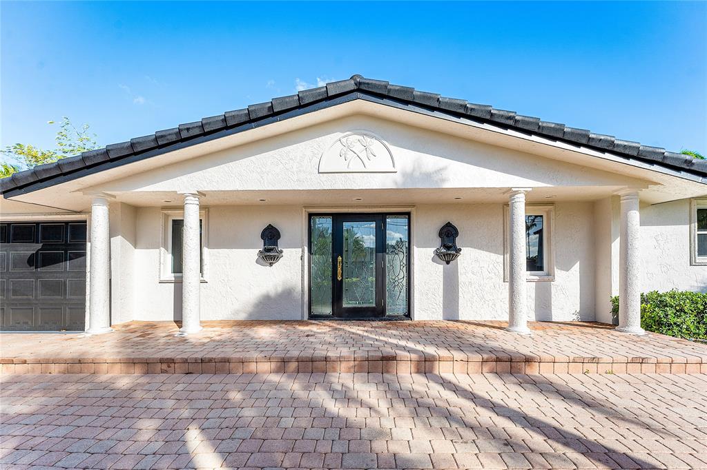 2443 Northeast 26th Street Lighthouse Point, FL 33064 - Photo 67 of 67 a front view of a house