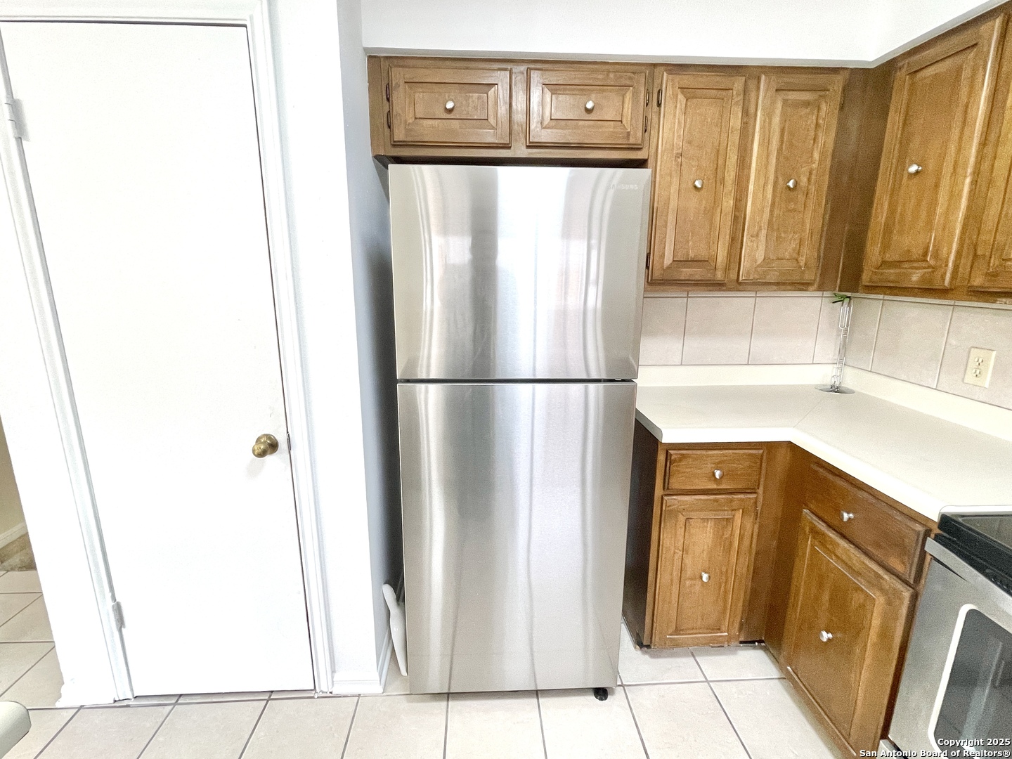 7738 Chambers Road, Unit 403 San Antonio, TX 78229 - Photo 19 of 37 a utility room with wooden floor washer and dryer