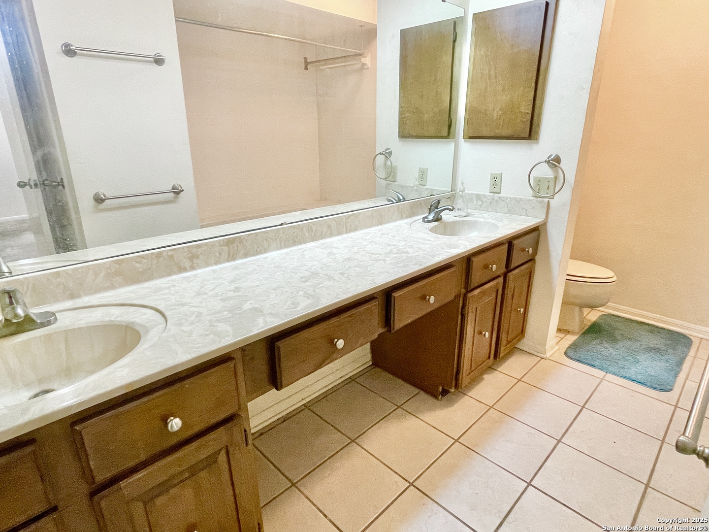 7738 Chambers Road, Unit 403 San Antonio, TX 78229 - Photo 26 of 37 a bathroom with a sink and a mirror