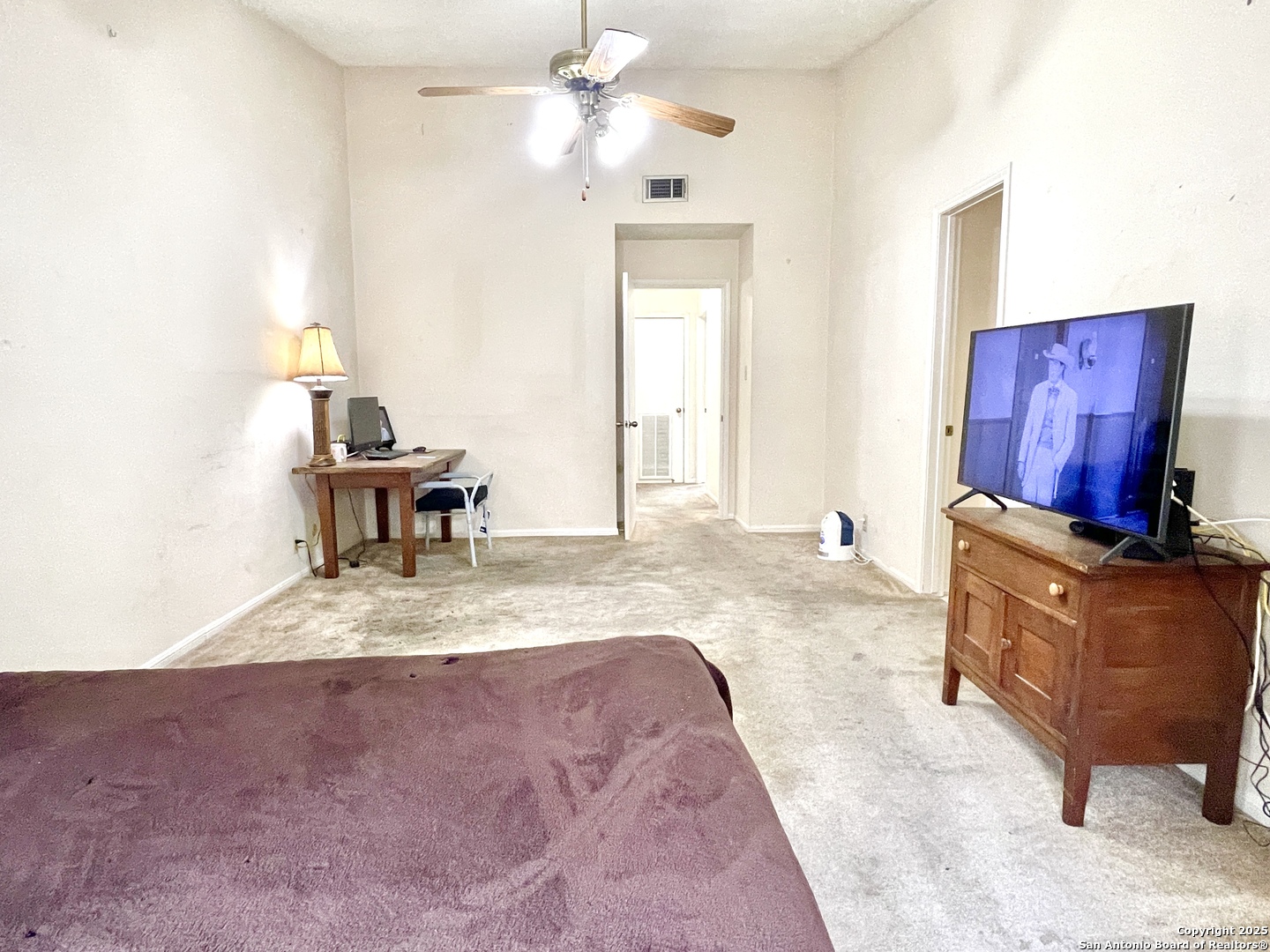 7738 Chambers Road, Unit 403 San Antonio, TX 78229 - Photo 27 of 37 a living room with furniture and a flat screen tv
