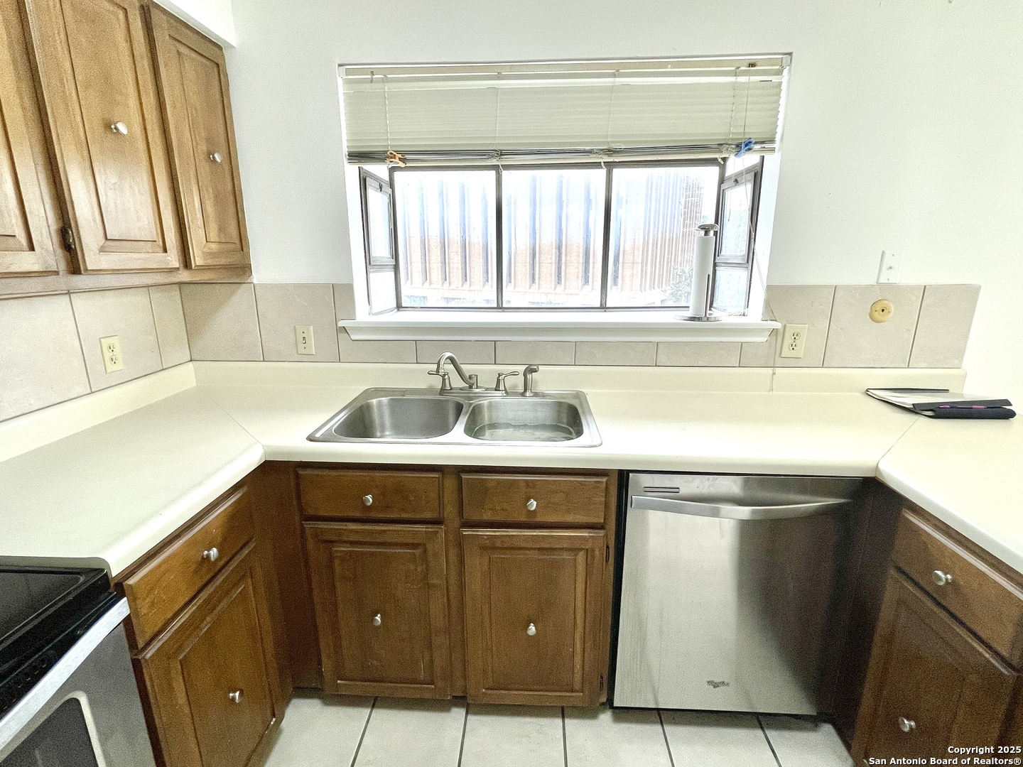 7738 Chambers Road, Unit 403 San Antonio, TX 78229 - Photo 3 of 37 a kitchen with a sink and cabinets