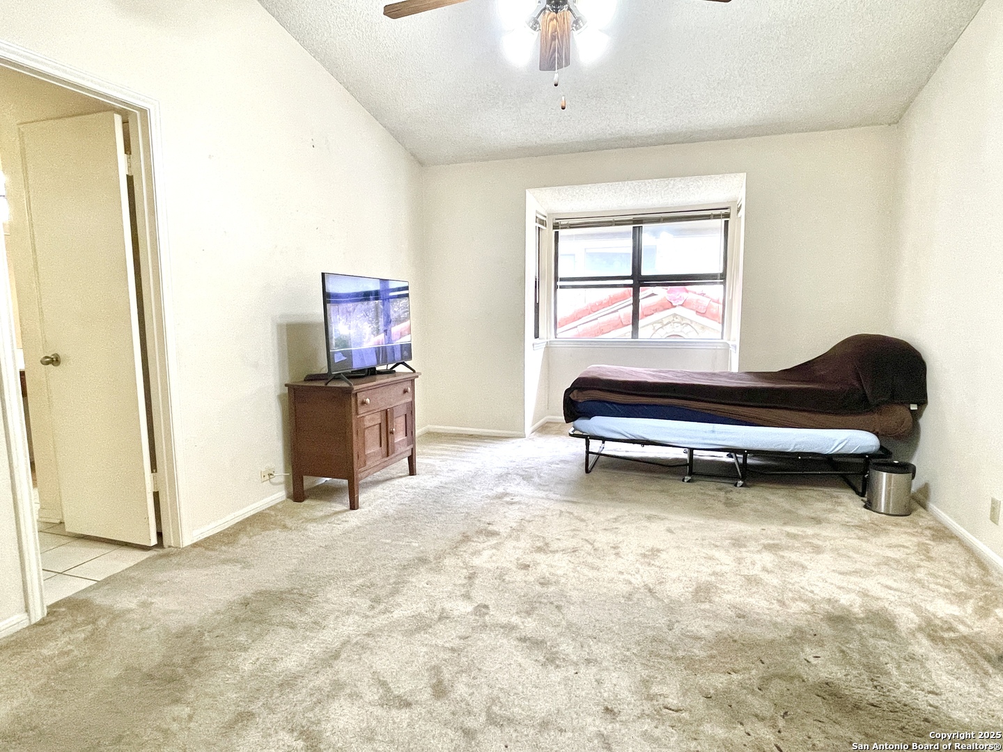 7738 Chambers Road, Unit 403 San Antonio, TX 78229 - Photo 33 of 37 a bedroom with a bed and a window