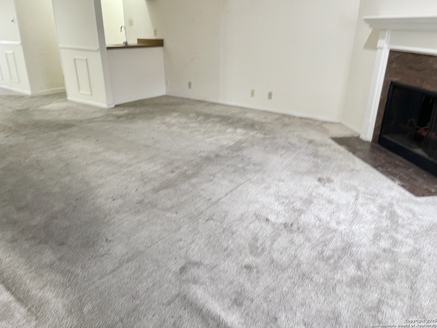 7738 Chambers Road, Unit 403 San Antonio, TX 78229 - Photo 9 of 37 a view of empty room with fireplace