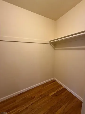 a view of a room with an empty walk in closet