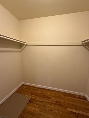 a view of a small space with wooden floor