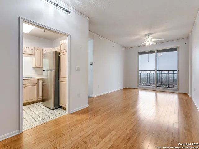 a kitchen with white cabinets appliances and a sink