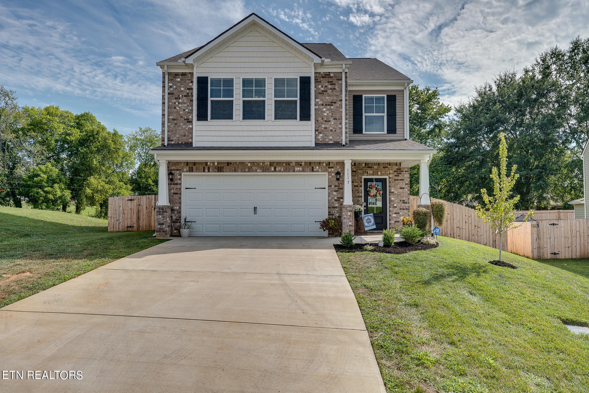front view of a house with a yard