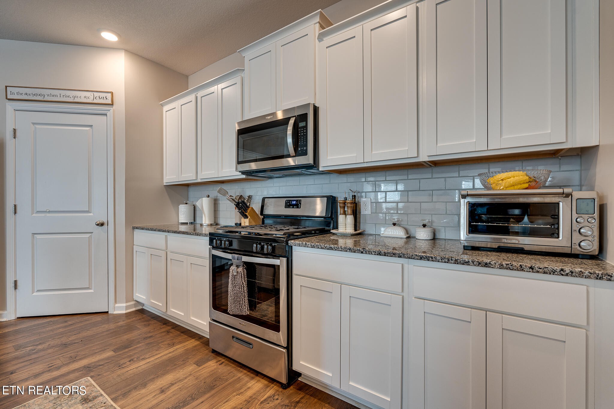 1117 Beacon Road Sevierville, TN 37876 - Photo 13 of 55 a kitchen with stainless steel appliances granite countertop white cabinets a sink and dishwasher