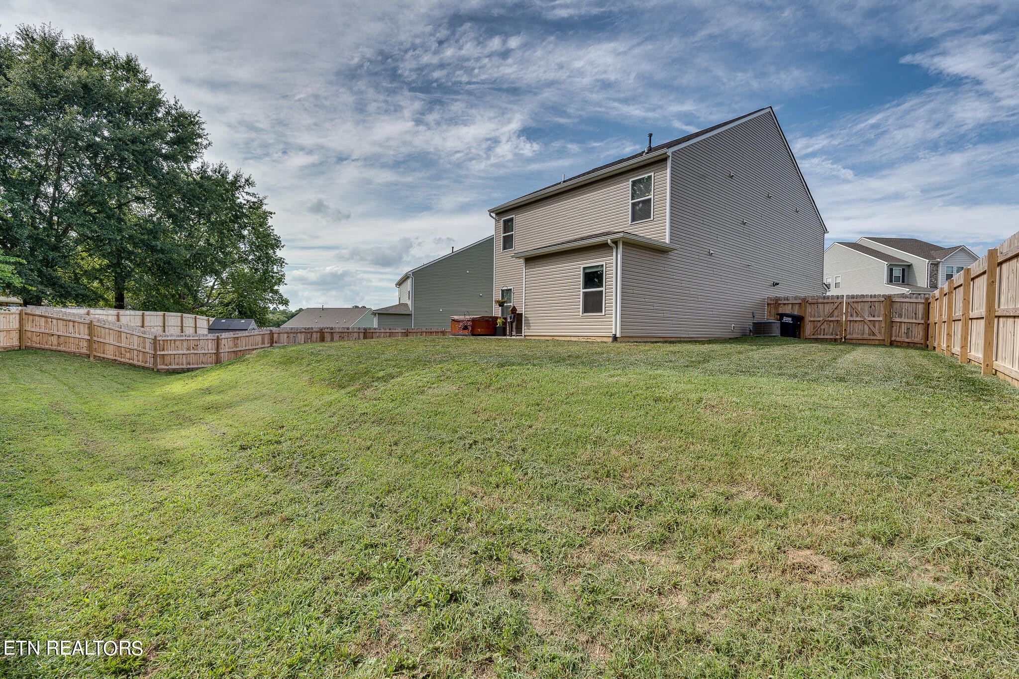 1117 Beacon Road Sevierville, TN 37876 - Photo 24 of 55 a big house with a yard and a large tree
