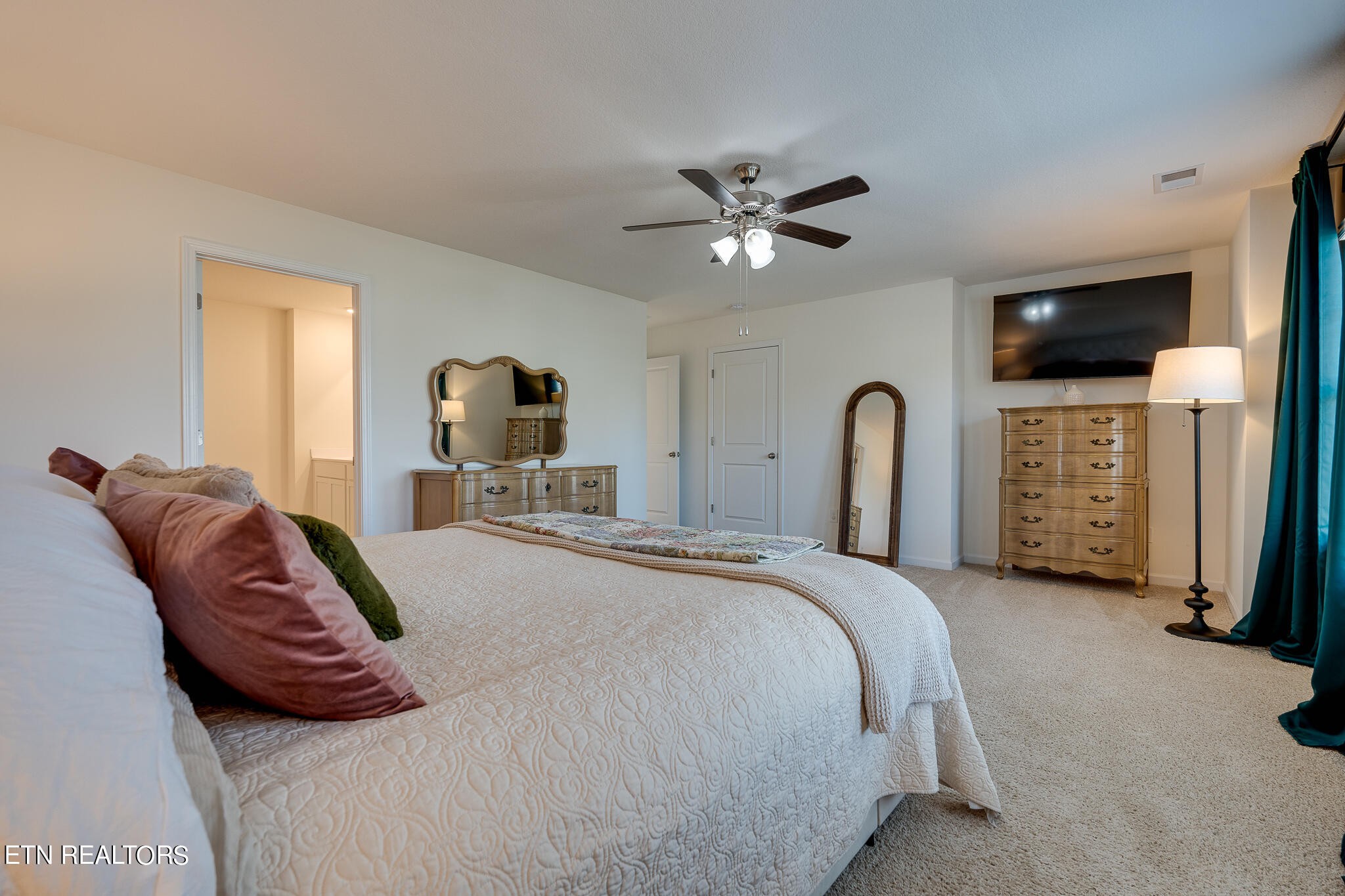 1117 Beacon Road Sevierville, TN 37876 - Photo 30 of 55 a bedroom with a bed and a flat screen tv