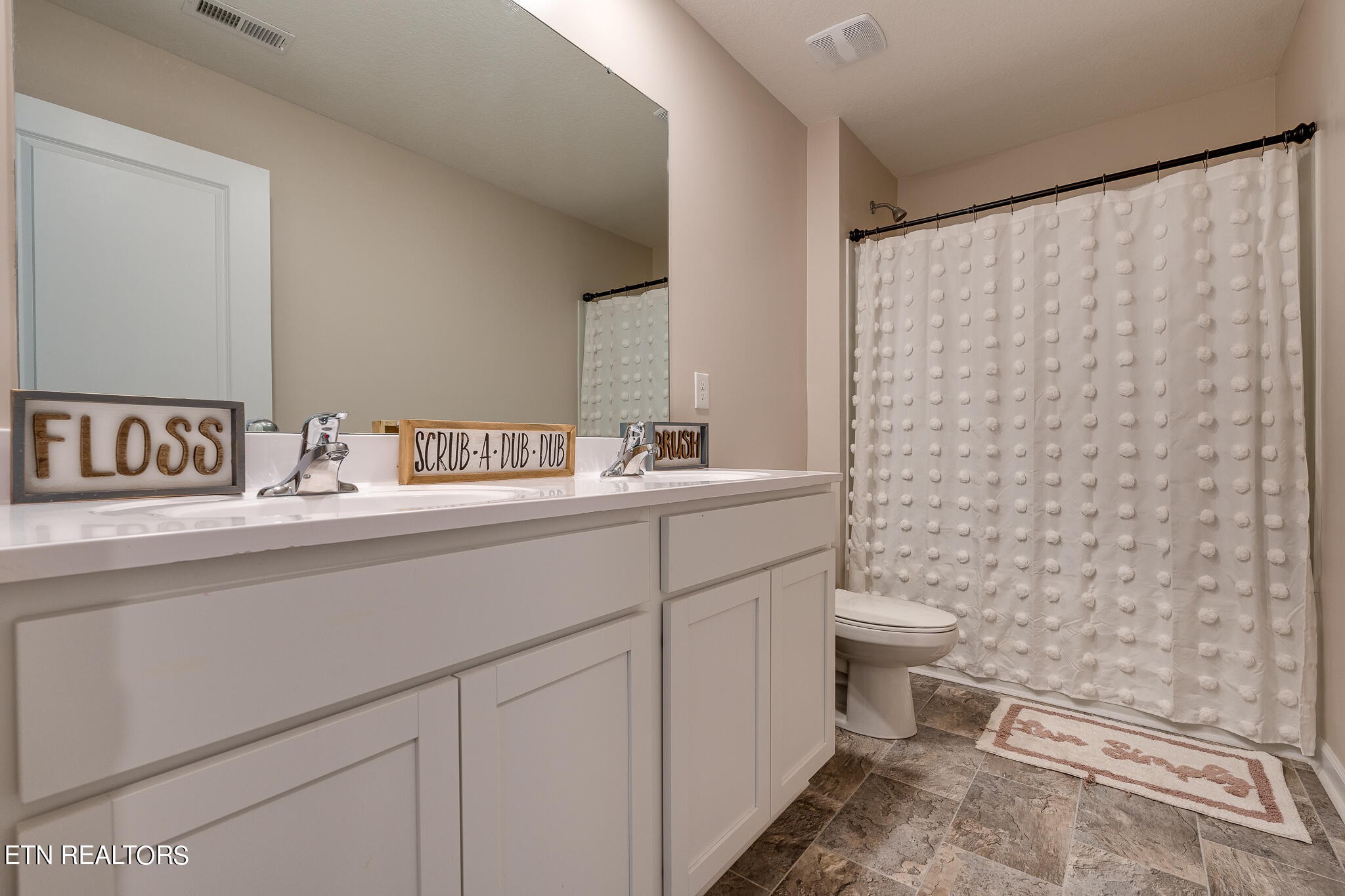 1117 Beacon Road Sevierville, TN 37876 - Photo 39 of 55 a bathroom with a sink and a toilet