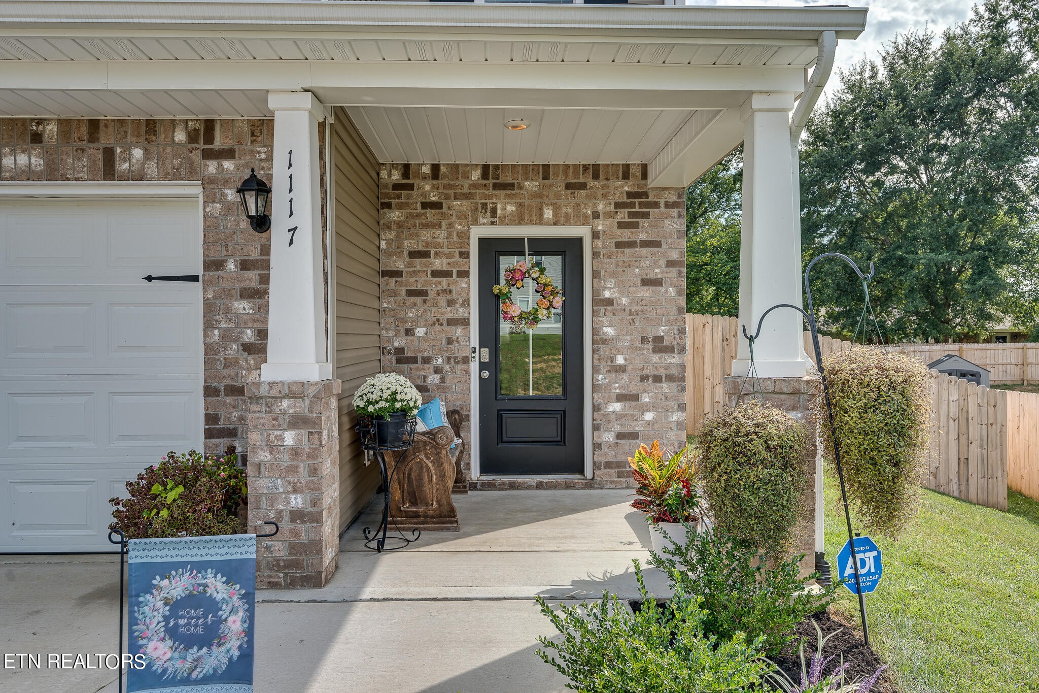 1117 Beacon Road Sevierville, TN 37876 - Photo 4 of 55 a front view of a house with garden