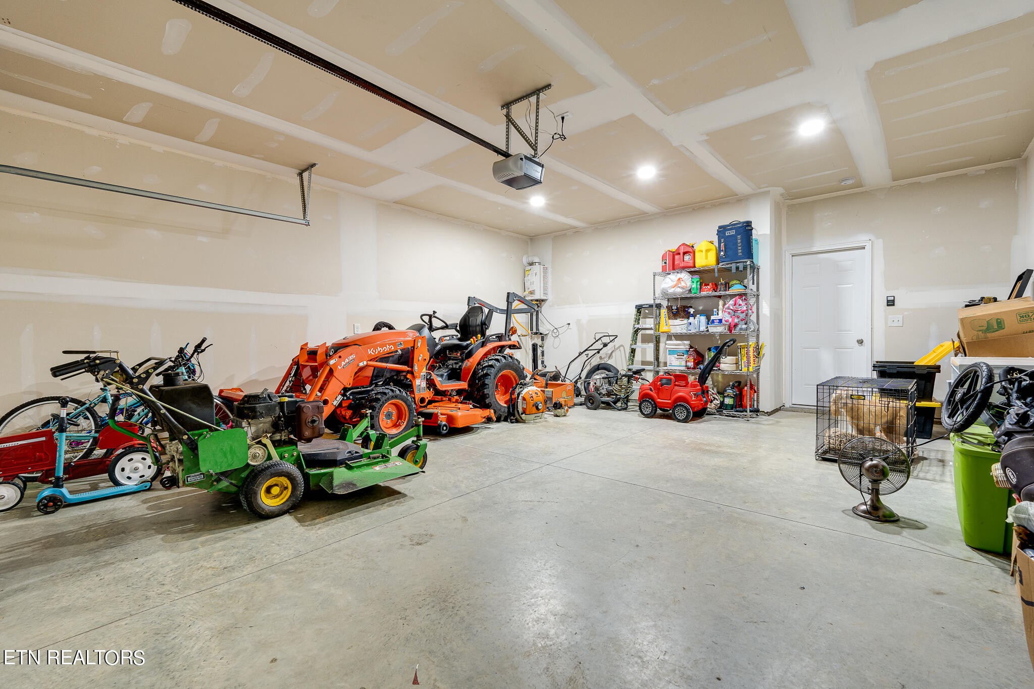 1117 Beacon Road Sevierville, TN 37876 - Photo 45 of 55 a view of a garage with a bike and car