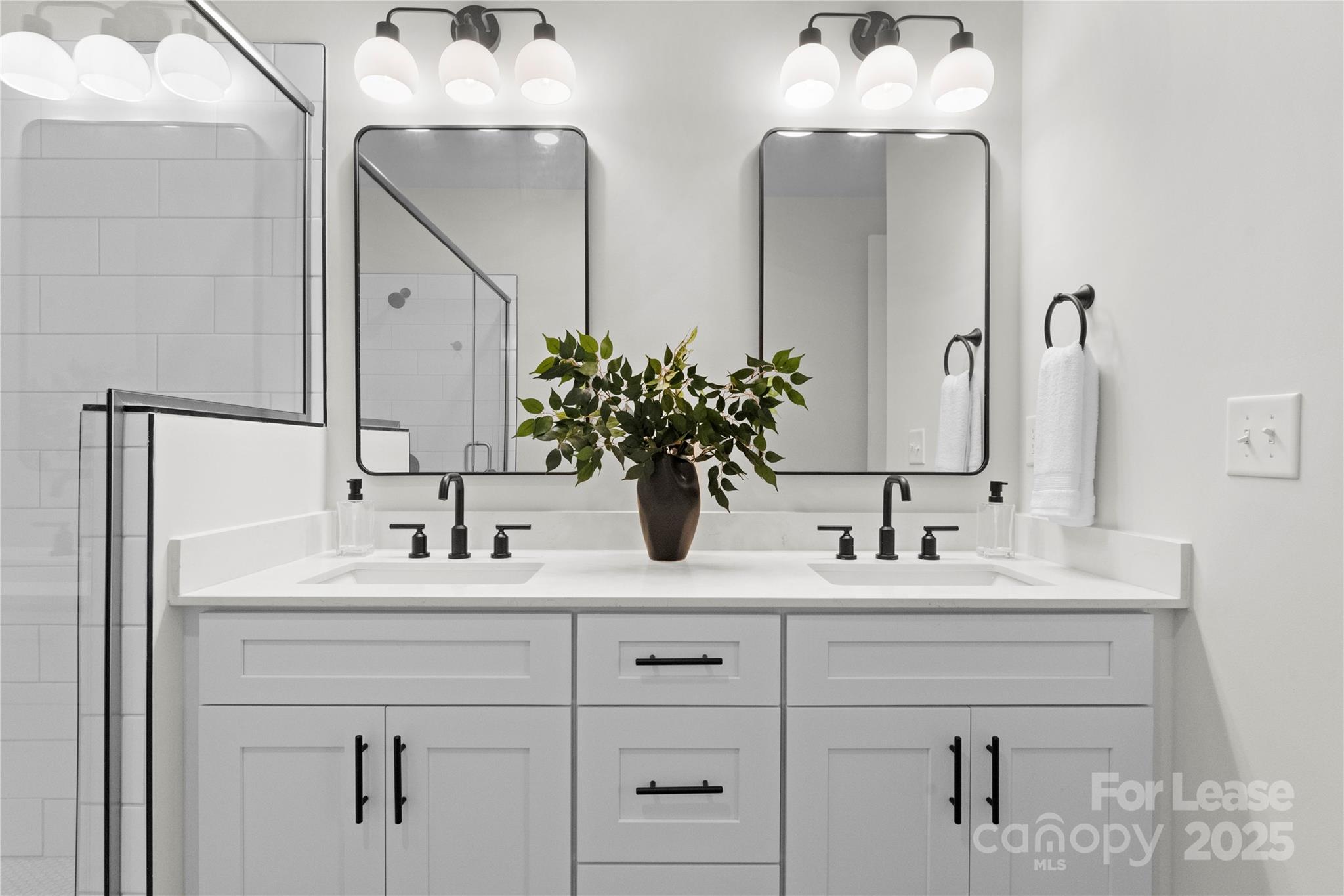 3232 Riley Avenue Charlotte, NC 28269 - Photo 13 of 19 a bathroom with double vanity sinks and a mirror