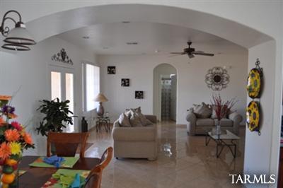 1415 Calle Monclova Rio Rico, AZ 85648 - Photo 10 of 16 a living room with furniture and flowers