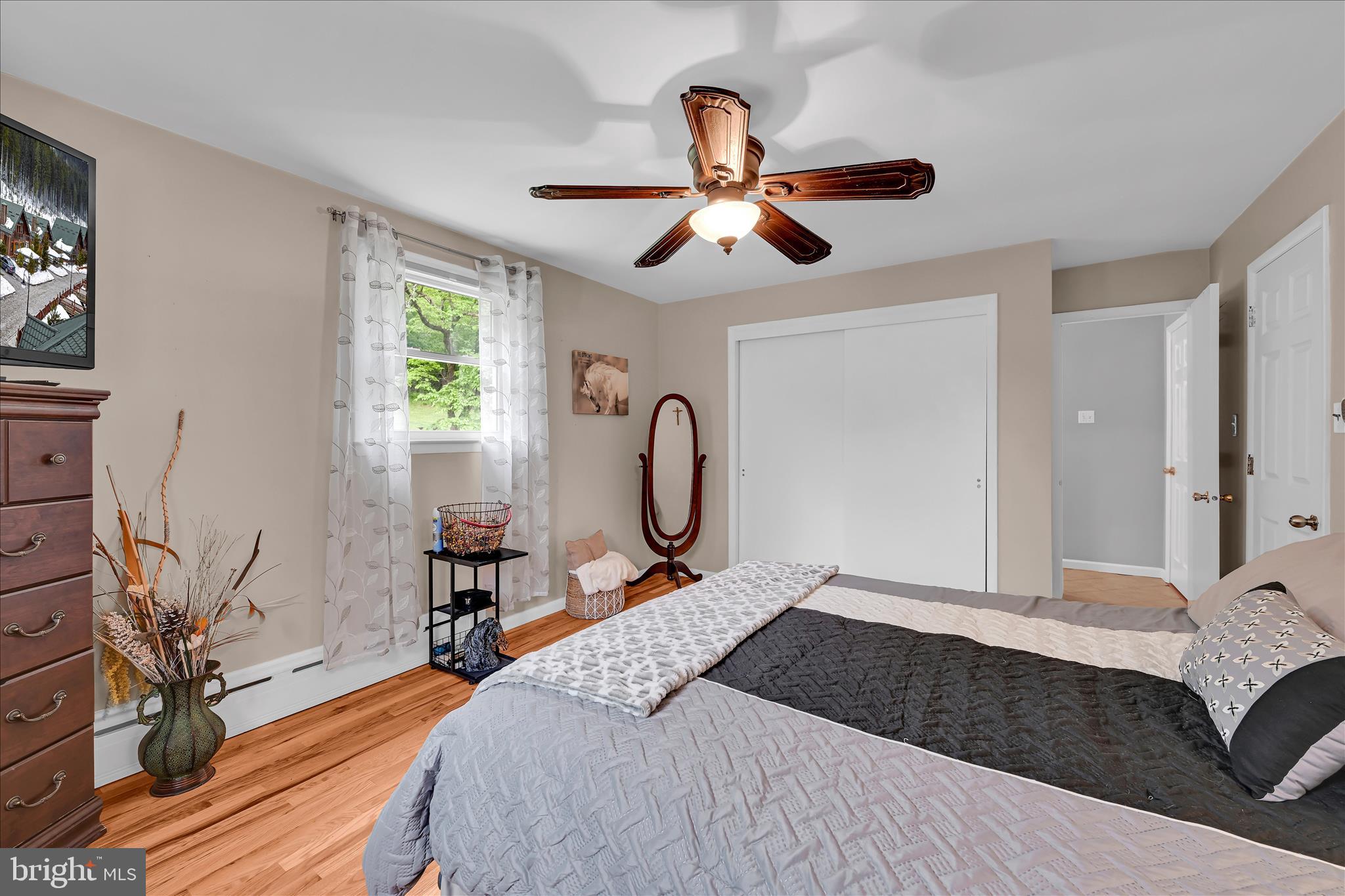 5220 Oley Turnpike Road Reading, PA 19606 - Photo 33 of 85 a bedroom with a bed ceiling fan and a window