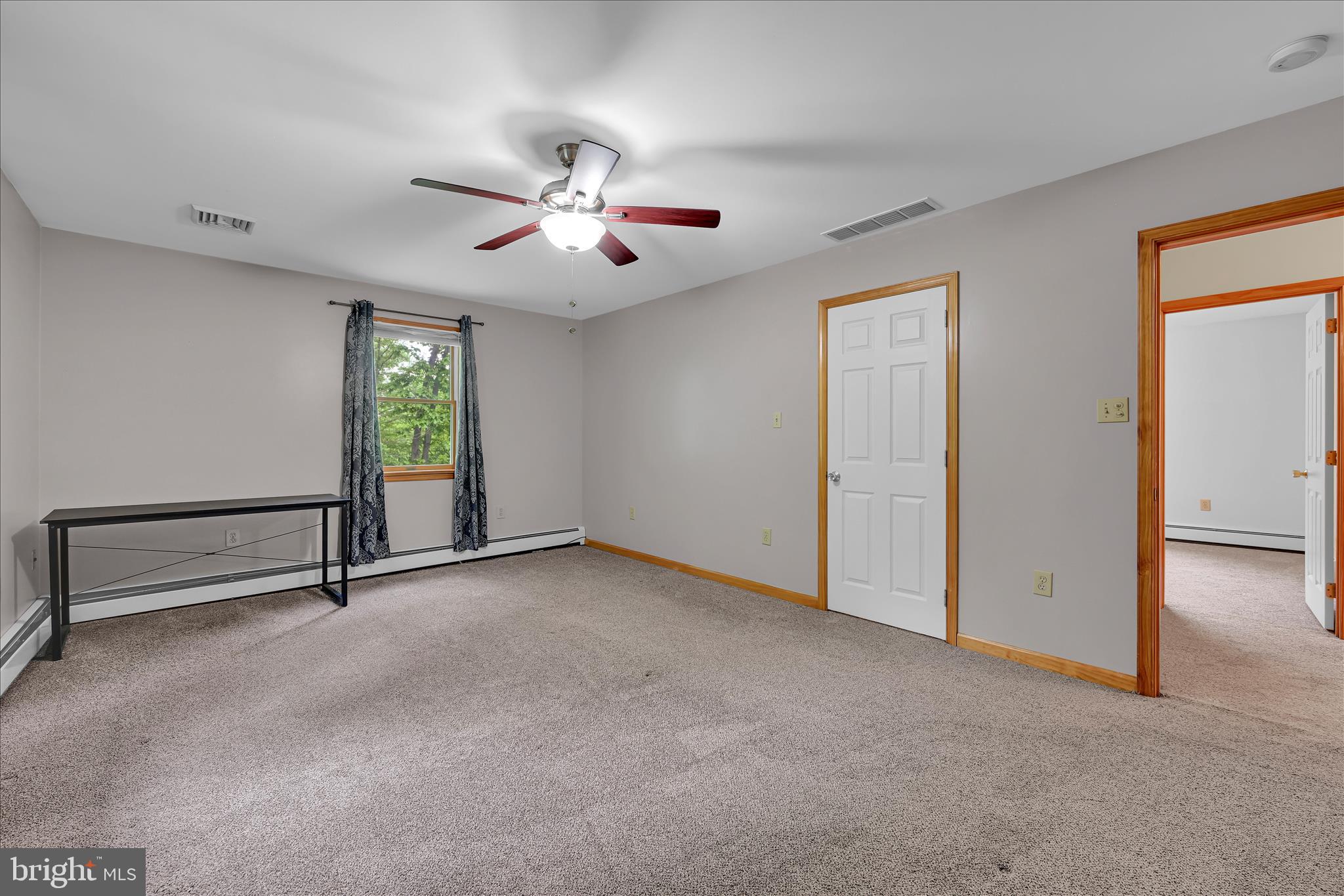 5220 Oley Turnpike Road Reading, PA 19606 - Photo 47 of 85 an empty room with windows and fan