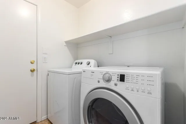 a utility room with dryer and washer