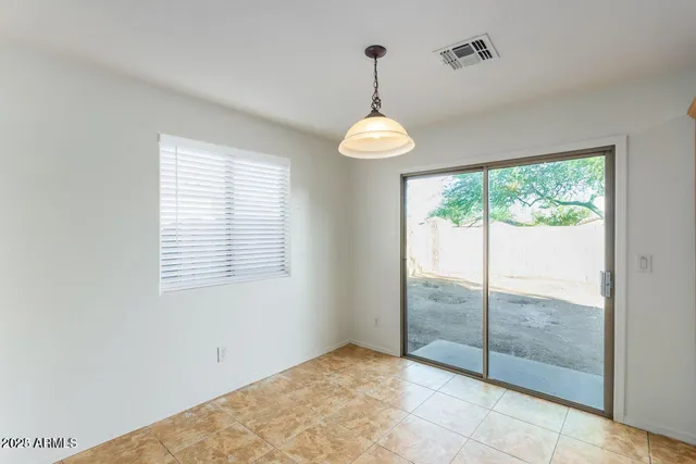 a view of a room with window chandelier and mountain view