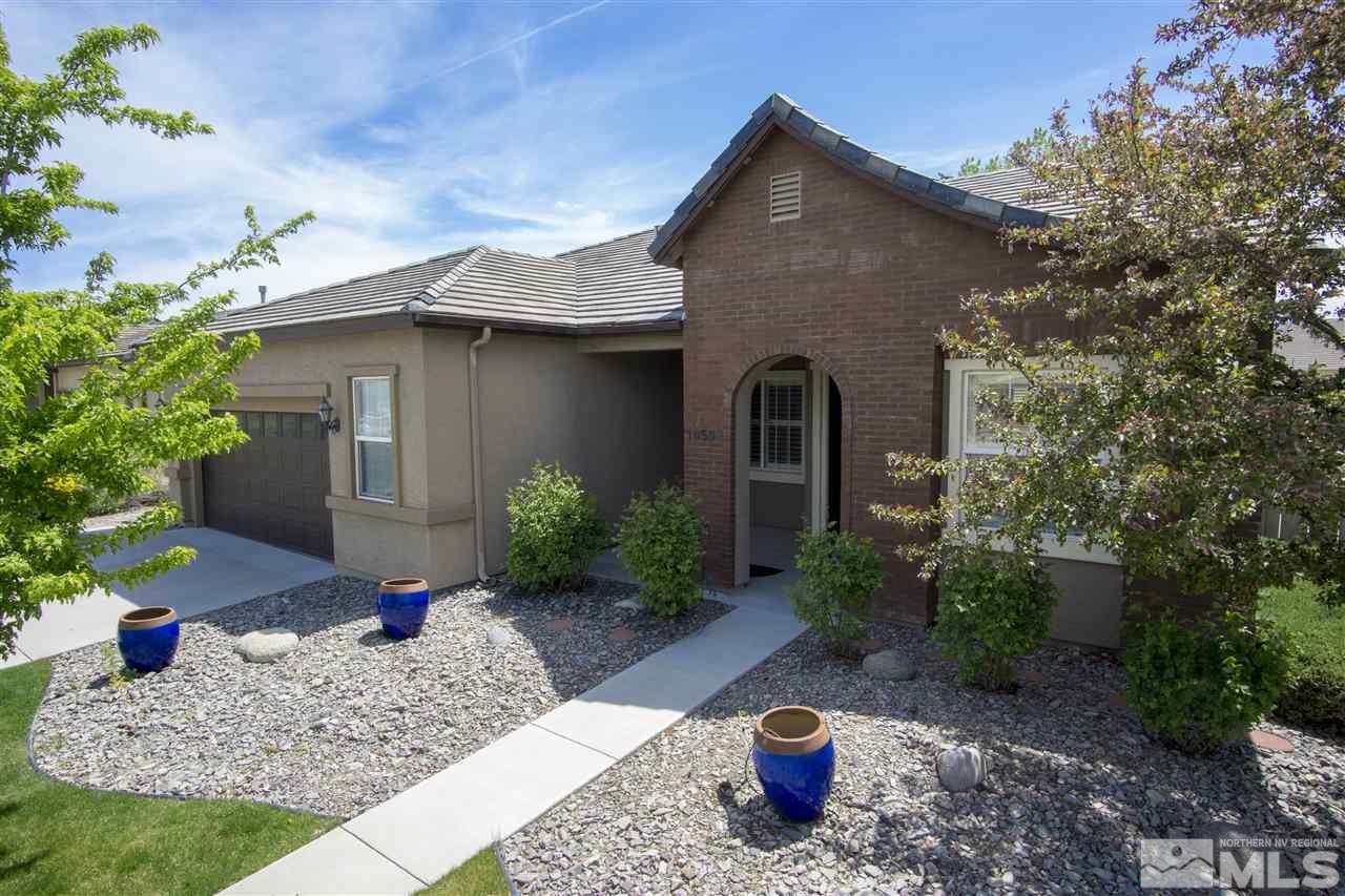 10598 Eagle Falls Way Reno, NV 89521 - Photo 1 of 17 a front view of a house with a yard