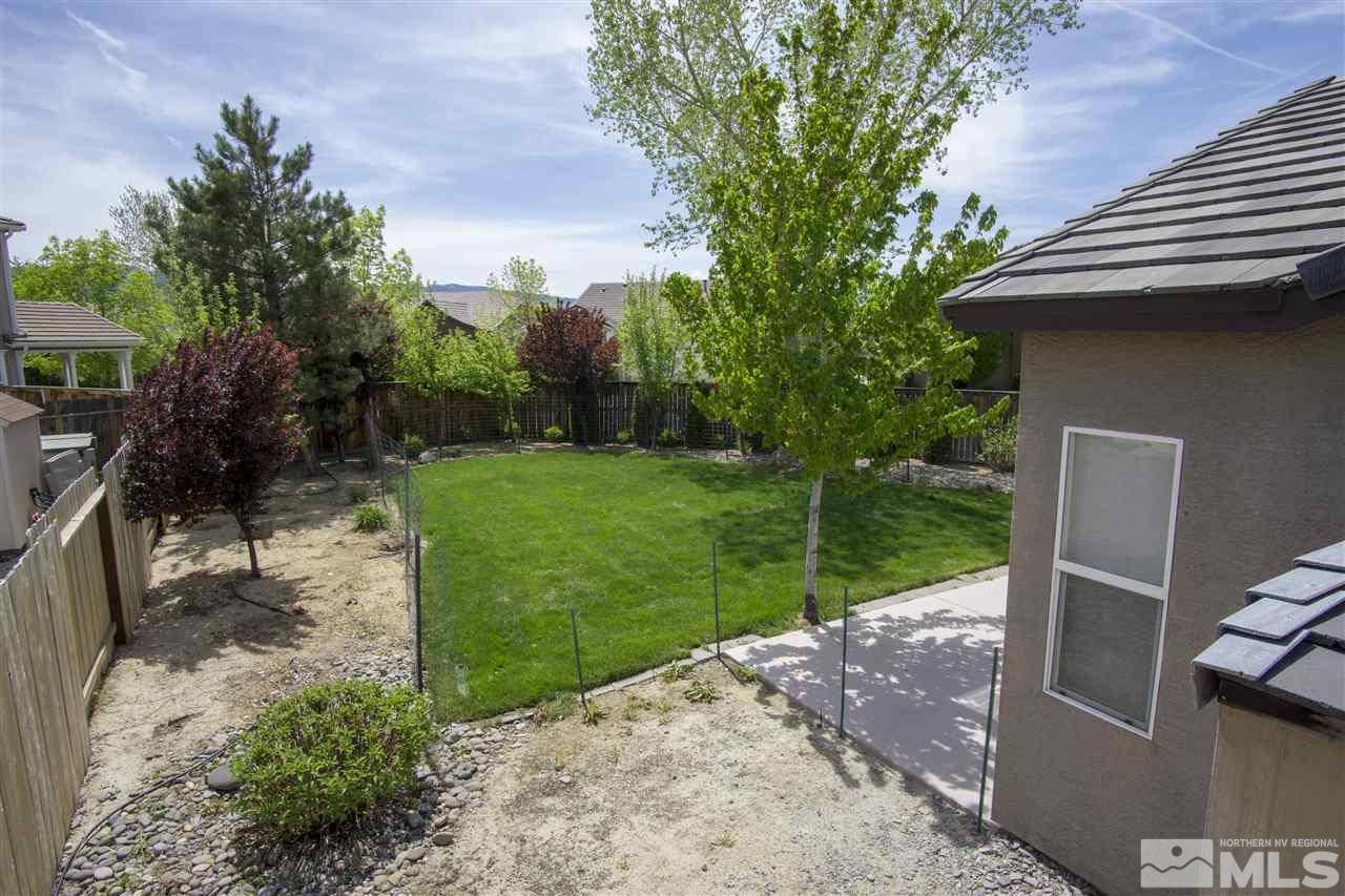 10598 Eagle Falls Way Reno, NV 89521 - Photo 14 of 17 a backyard of a house with lots of green space