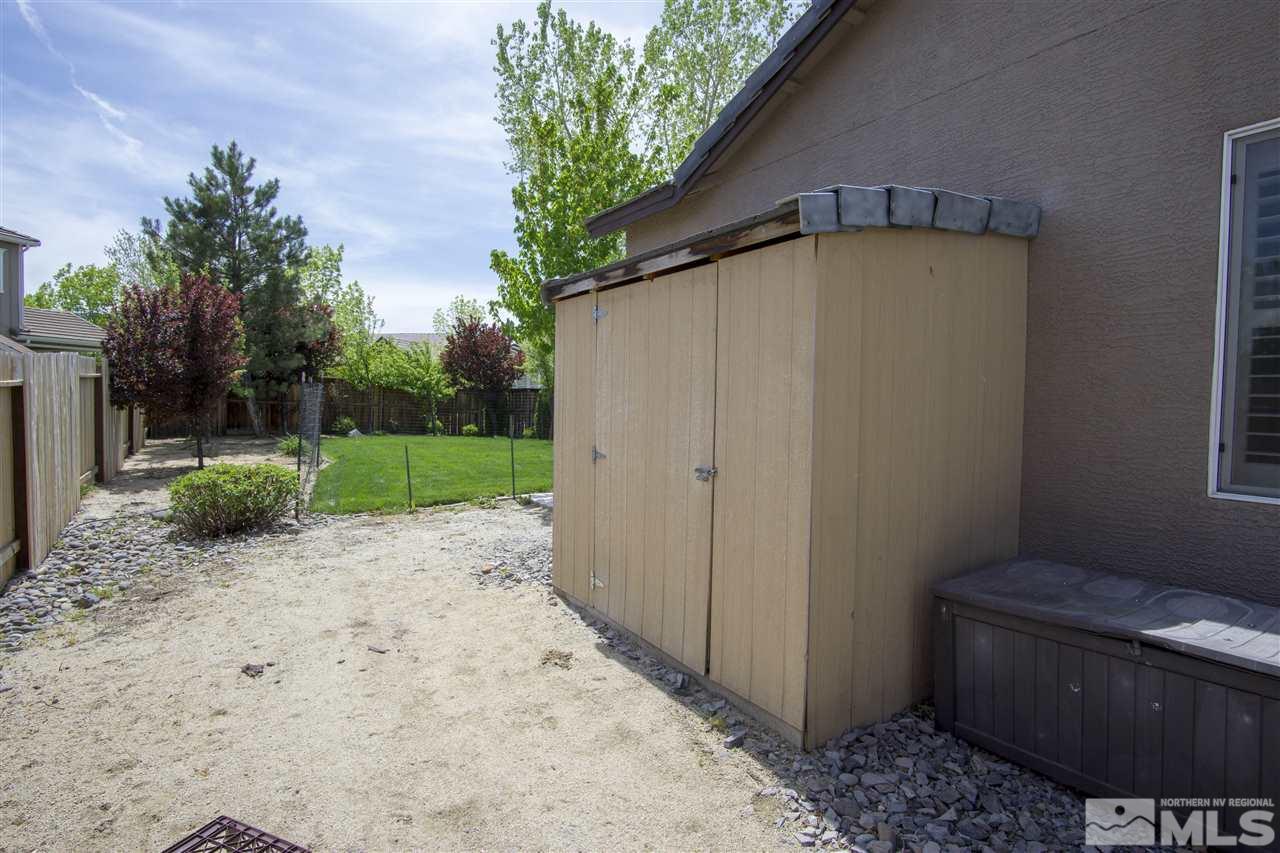 10598 Eagle Falls Way Reno, NV 89521 - Photo 15 of 17 a backyard of a house with lots of green space