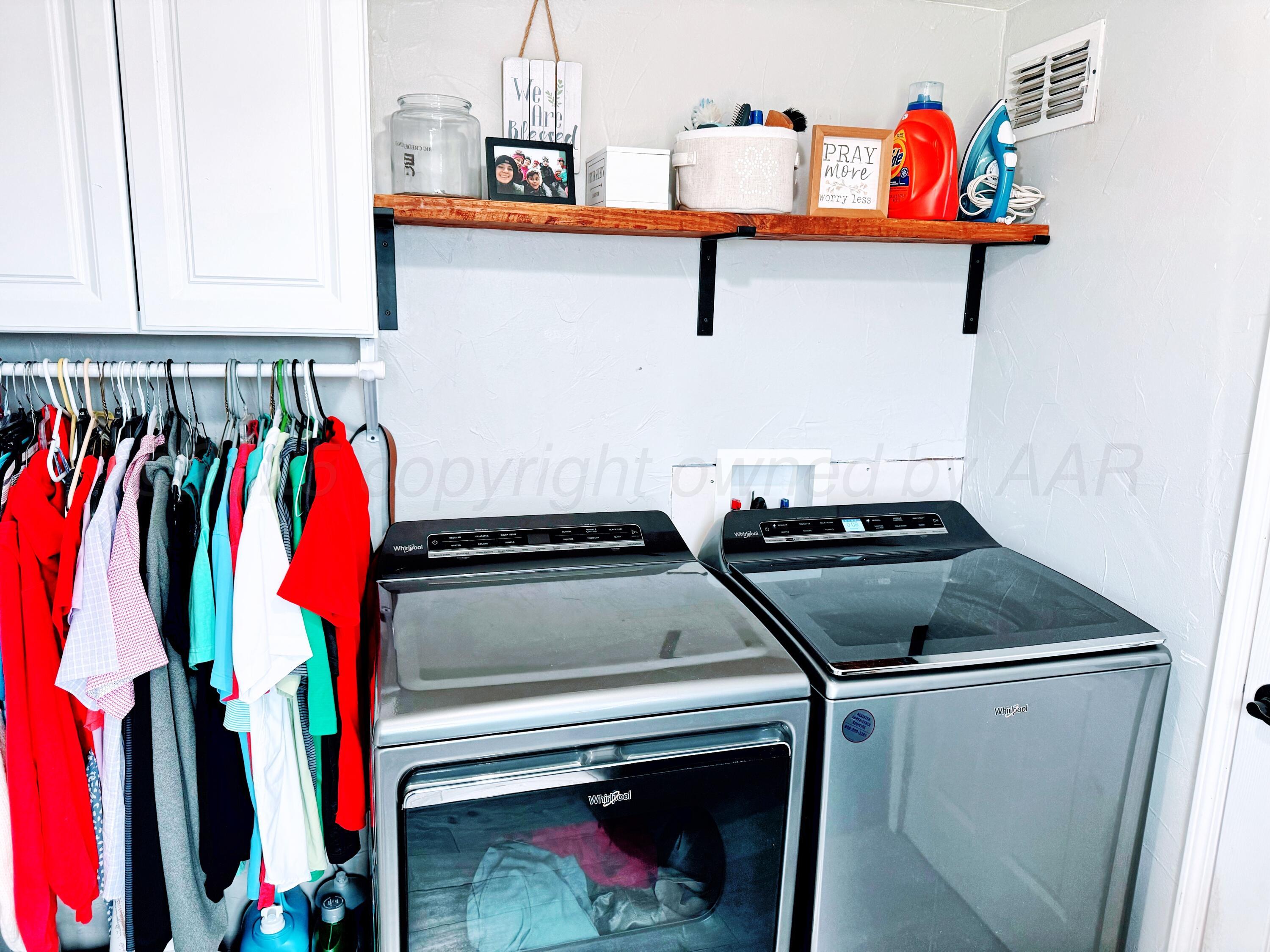 14155 County Road 7 Perryton, TX 79070 - Photo 16 of 25 a utility room with dryer and washer