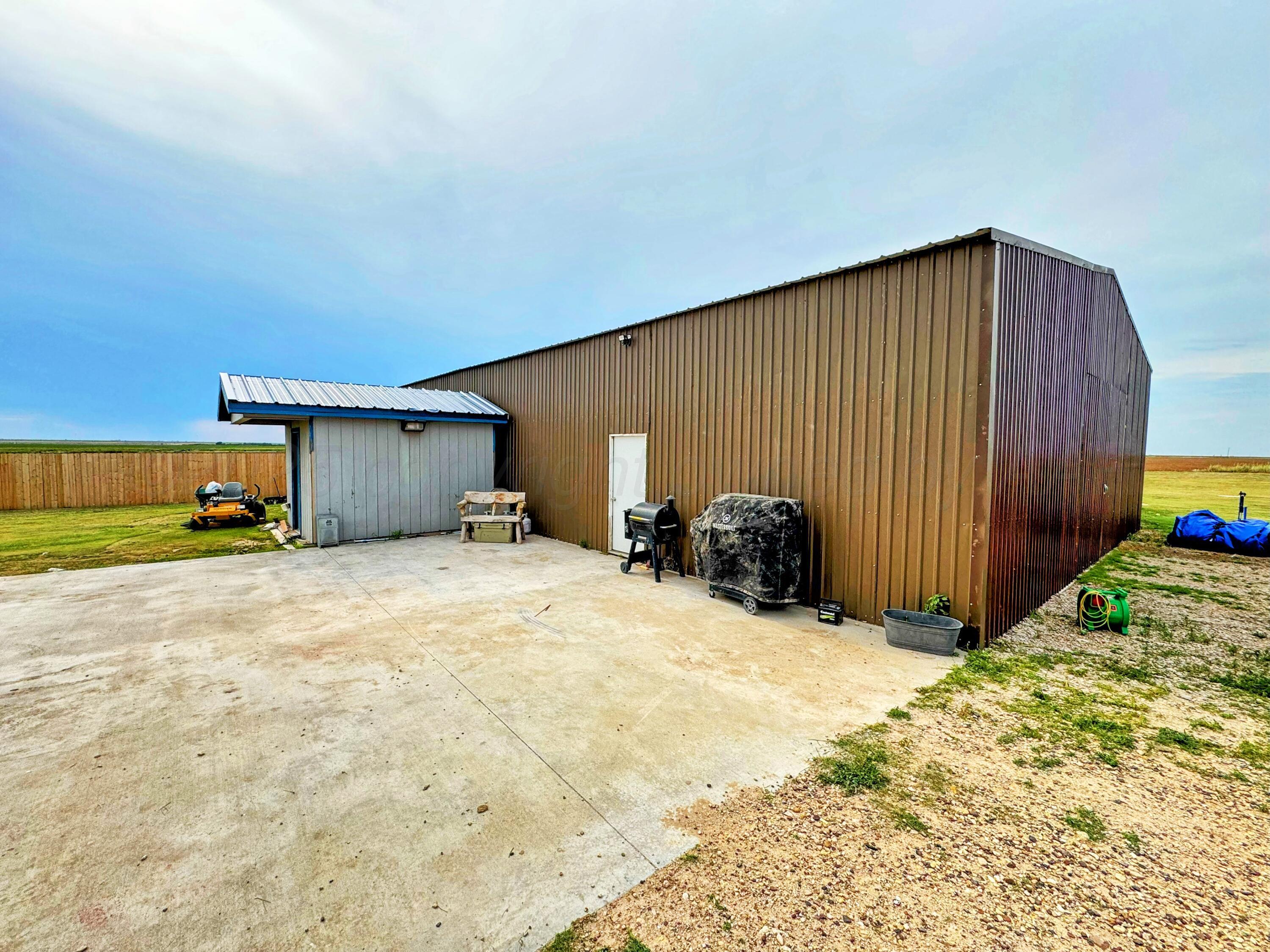 14155 County Road 7 Perryton, TX 79070 - Photo 21 of 25 a view of a house with a yard