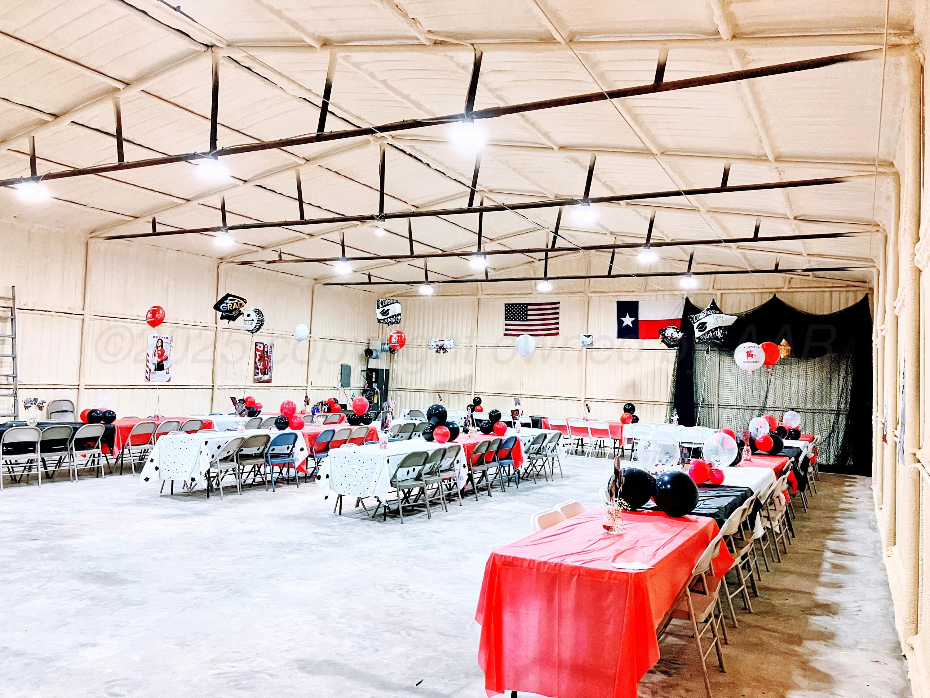 14155 County Road 7 Perryton, TX 79070 - Photo 22 of 25 a garage with a baby and a table and chairs