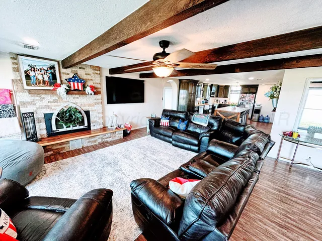 a living room with furniture and flat screen tv