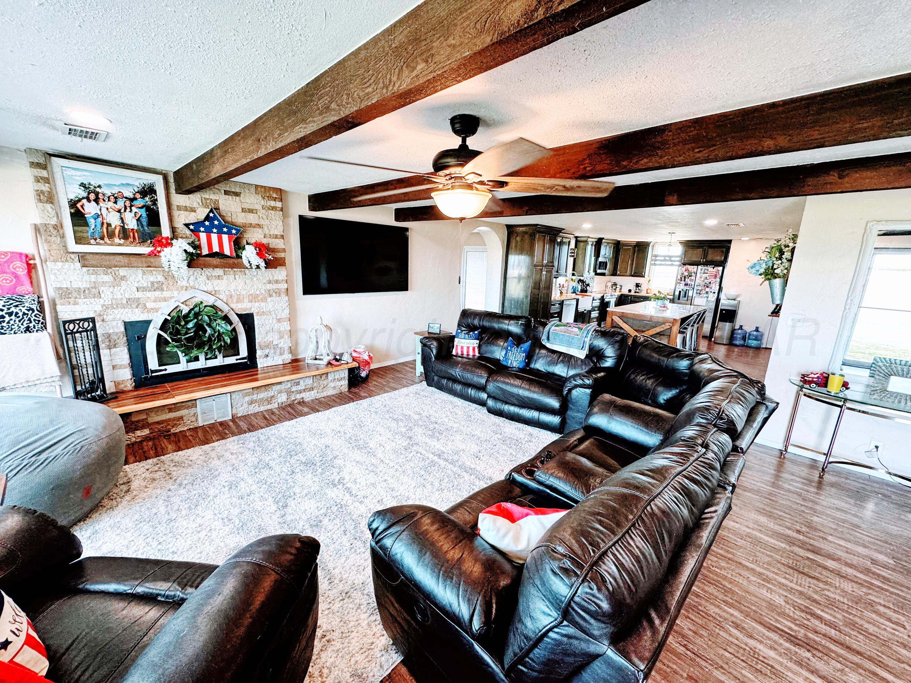 14155 County Road 7 Perryton, TX 79070 - Photo 3 of 25 a living room with furniture and flat screen tv
