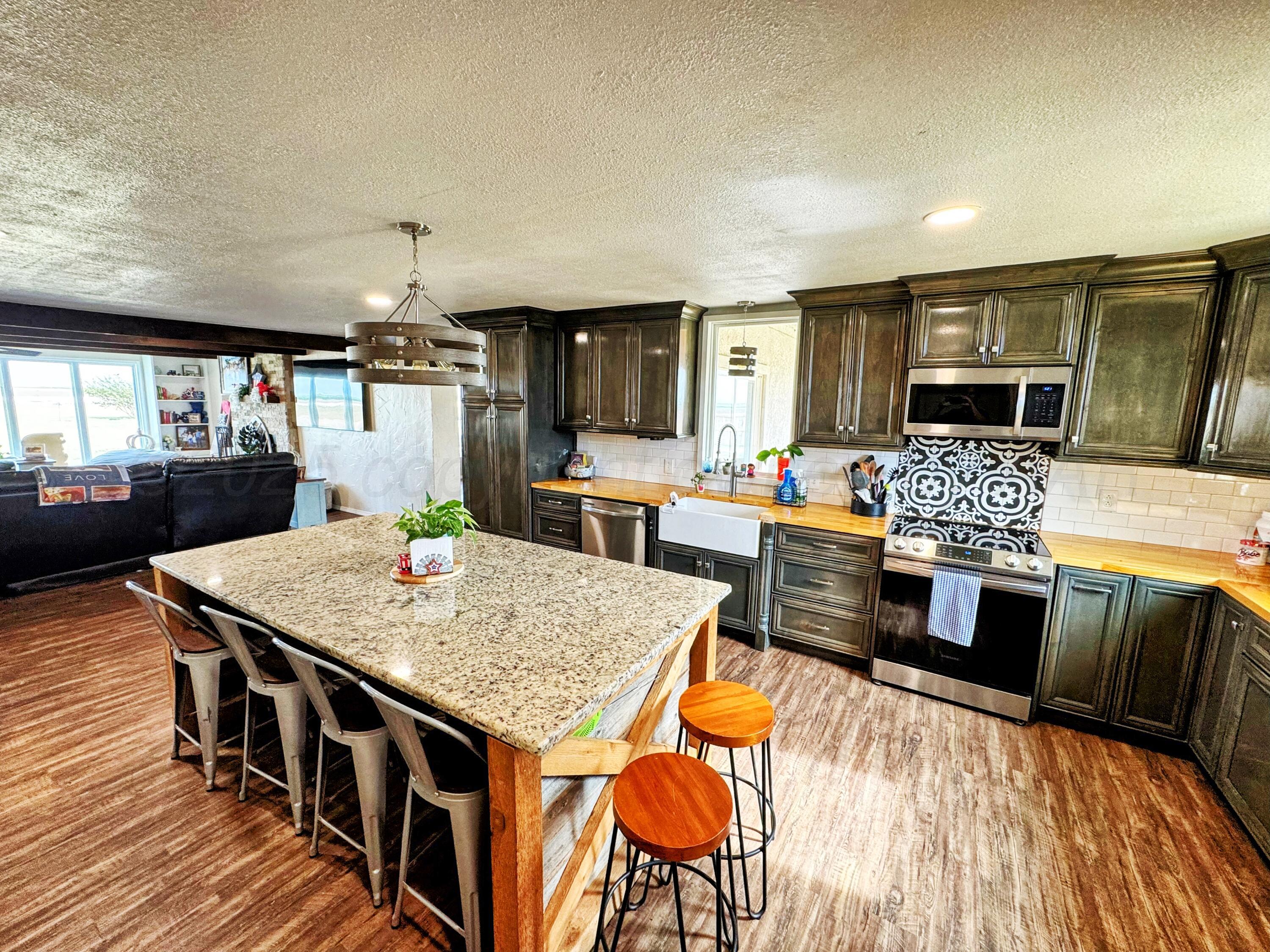 14155 County Road 7 Perryton, TX 79070 - Photo 6 of 25 a view of a dining room with furniture