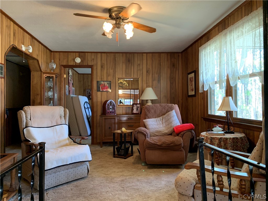 1079 CCC Road Crewe, VA 23930 - Photo 18 of 33 a living room with furniture a ceiling fan and a window