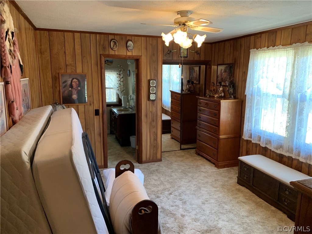 1079 CCC Road Crewe, VA 23930 - Photo 19 of 33 a bed room with a bed and a chandelier