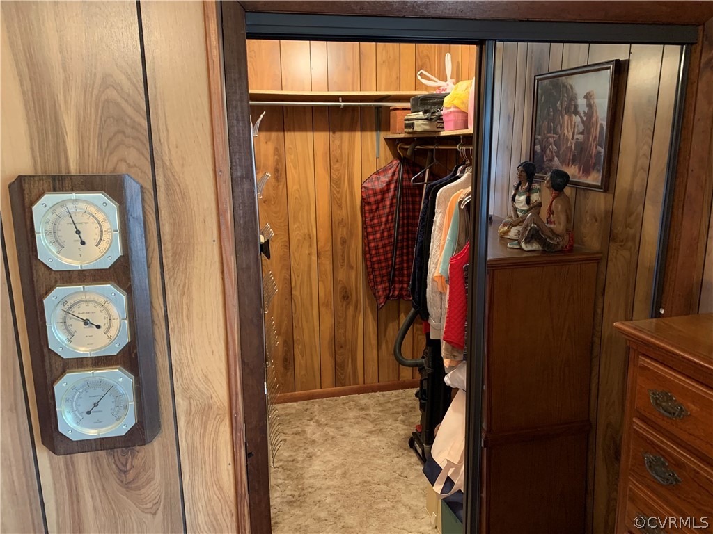 1079 CCC Road Crewe, VA 23930 - Photo 20 of 33 a view of walk in closet with clothes