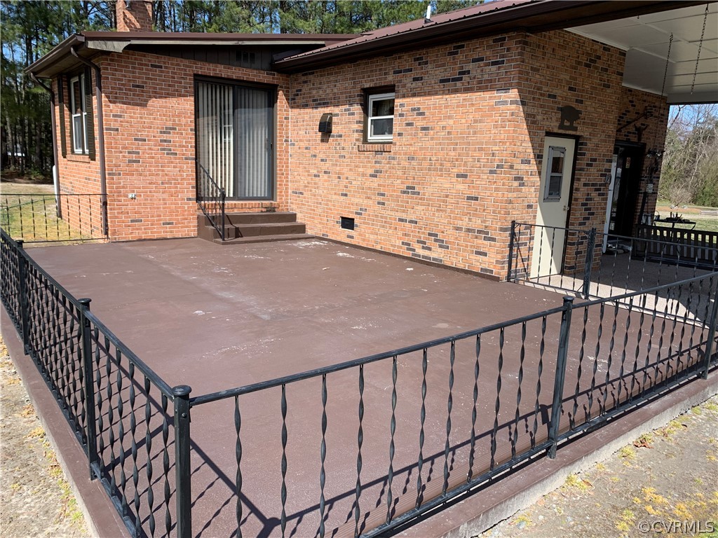 1079 CCC Road Crewe, VA 23930 - Photo 5 of 33 a balcony with table and chairs