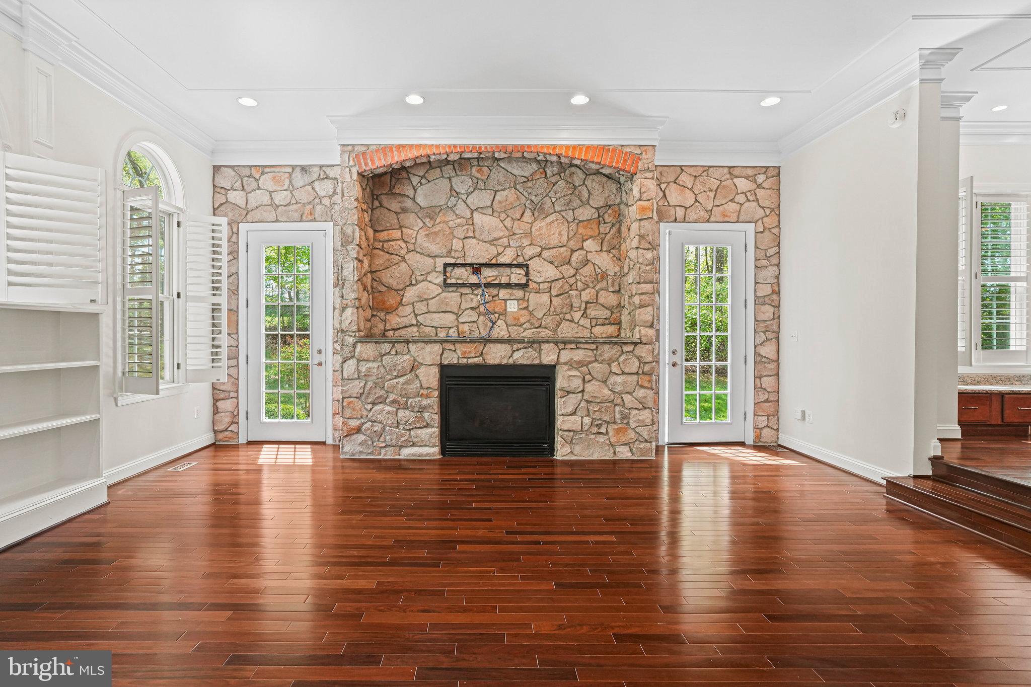 13551 Triadelphia Mill Road Clarksville, MD 21029 - Photo 12 of 74 a view of a livingroom with wooden floor and a fireplace