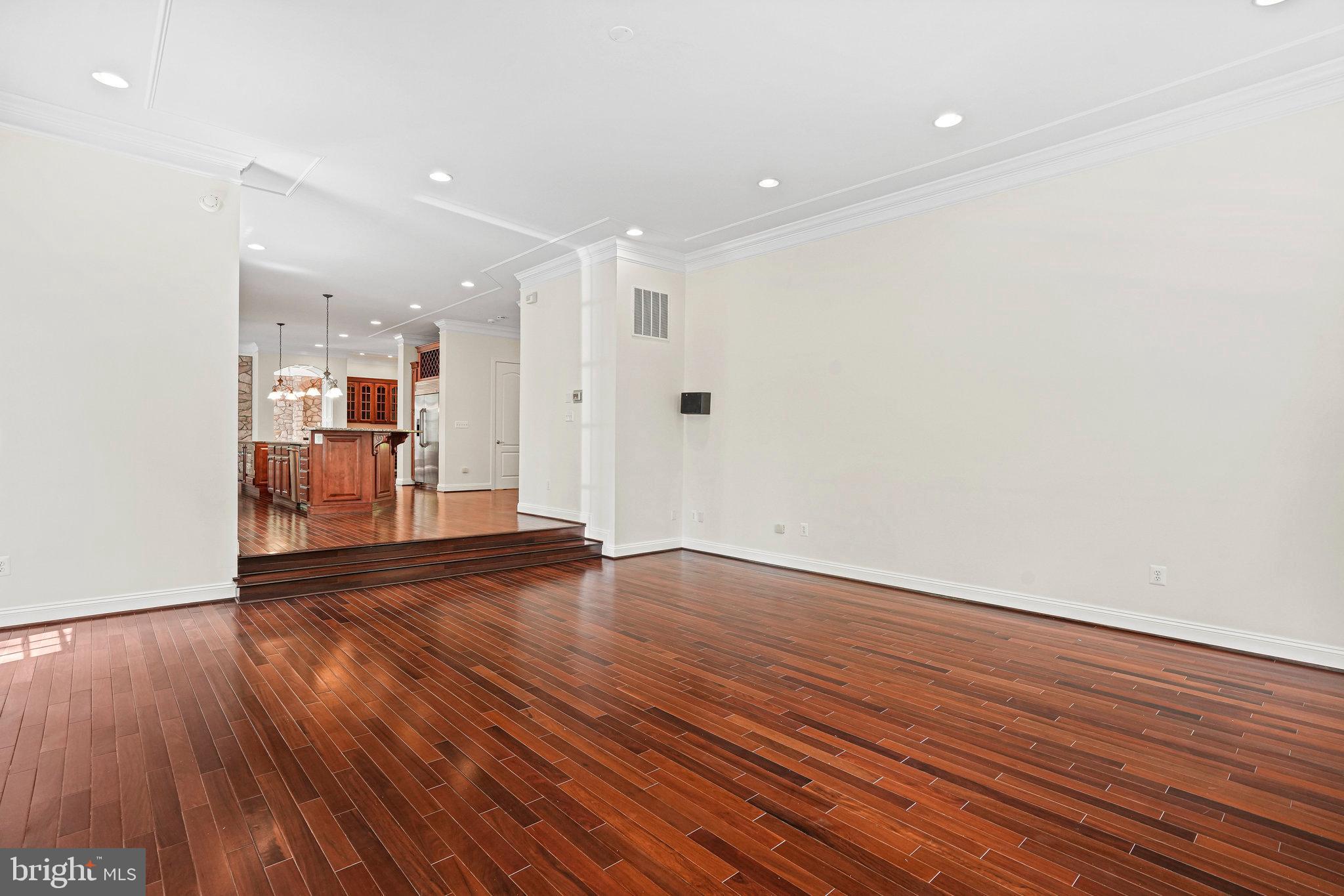 13551 Triadelphia Mill Road Clarksville, MD 21029 - Photo 13 of 74 a view of a big room with wooden floor and windows