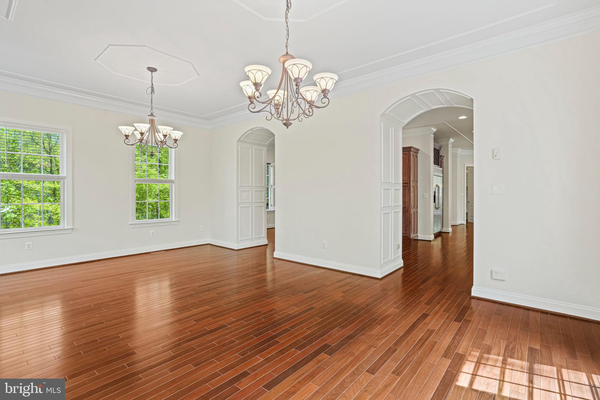 13551 Triadelphia Mill Road Clarksville, MD 21029 - Photo 24 of 74 a view of a room with wooden floor chandelier and windows