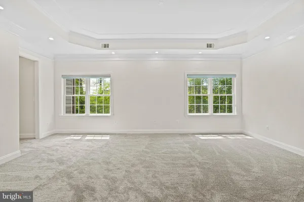 a white bath tub sitting next to a window