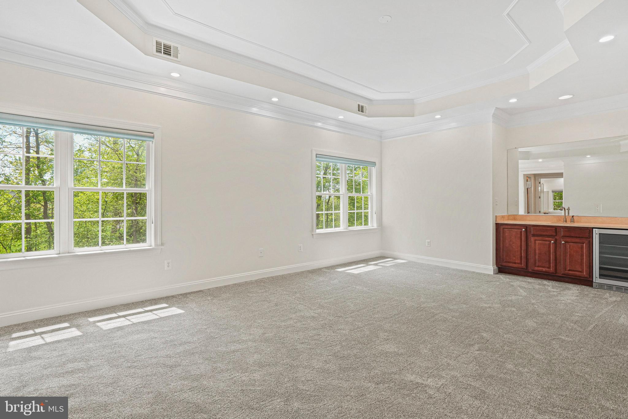 13551 Triadelphia Mill Road Clarksville, MD 21029 - Photo 27 of 74 an empty room with windows and cabinet