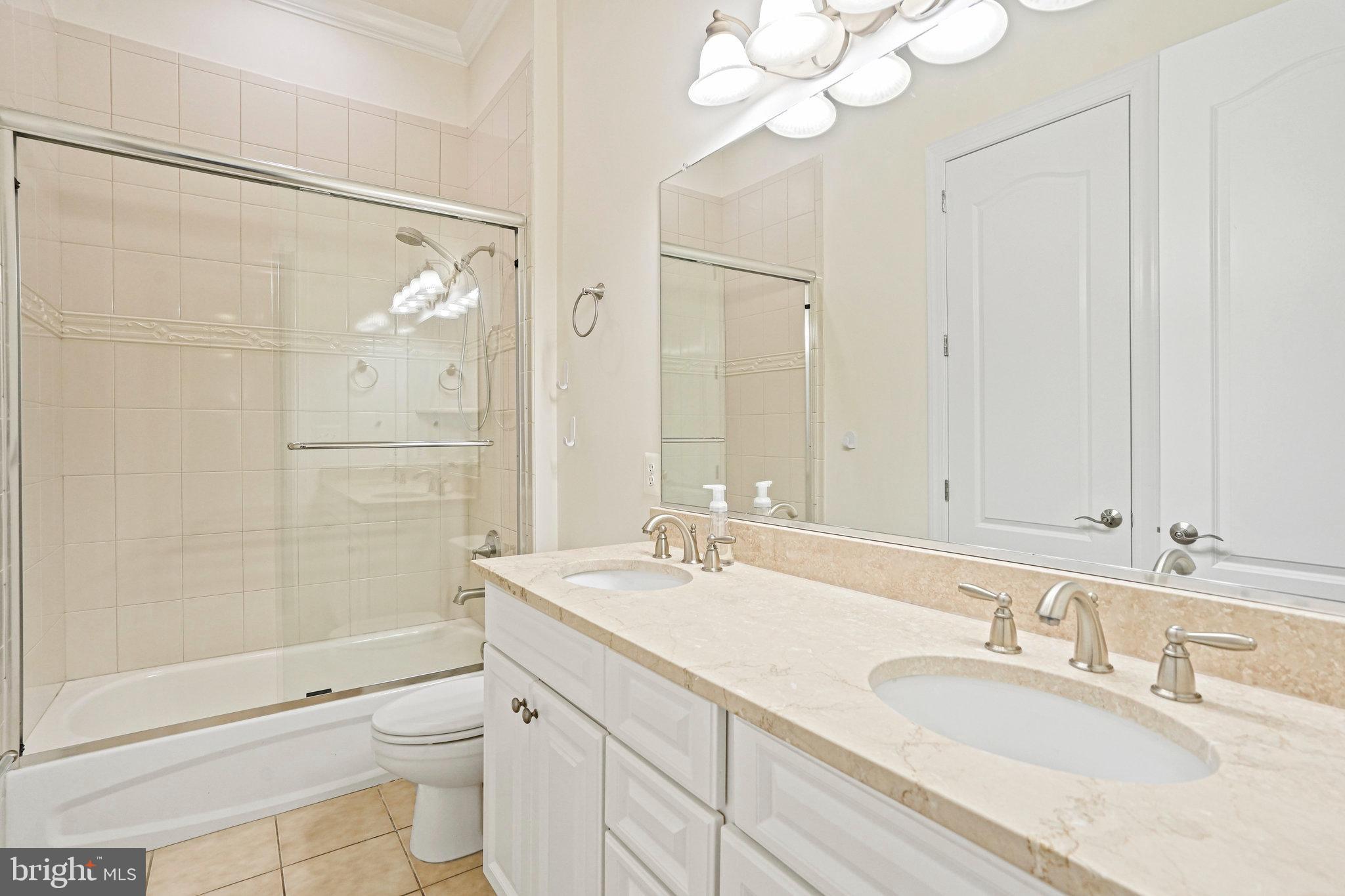13551 Triadelphia Mill Road Clarksville, MD 21029 - Photo 33 of 74 a bathroom with a sink a toilet and shower