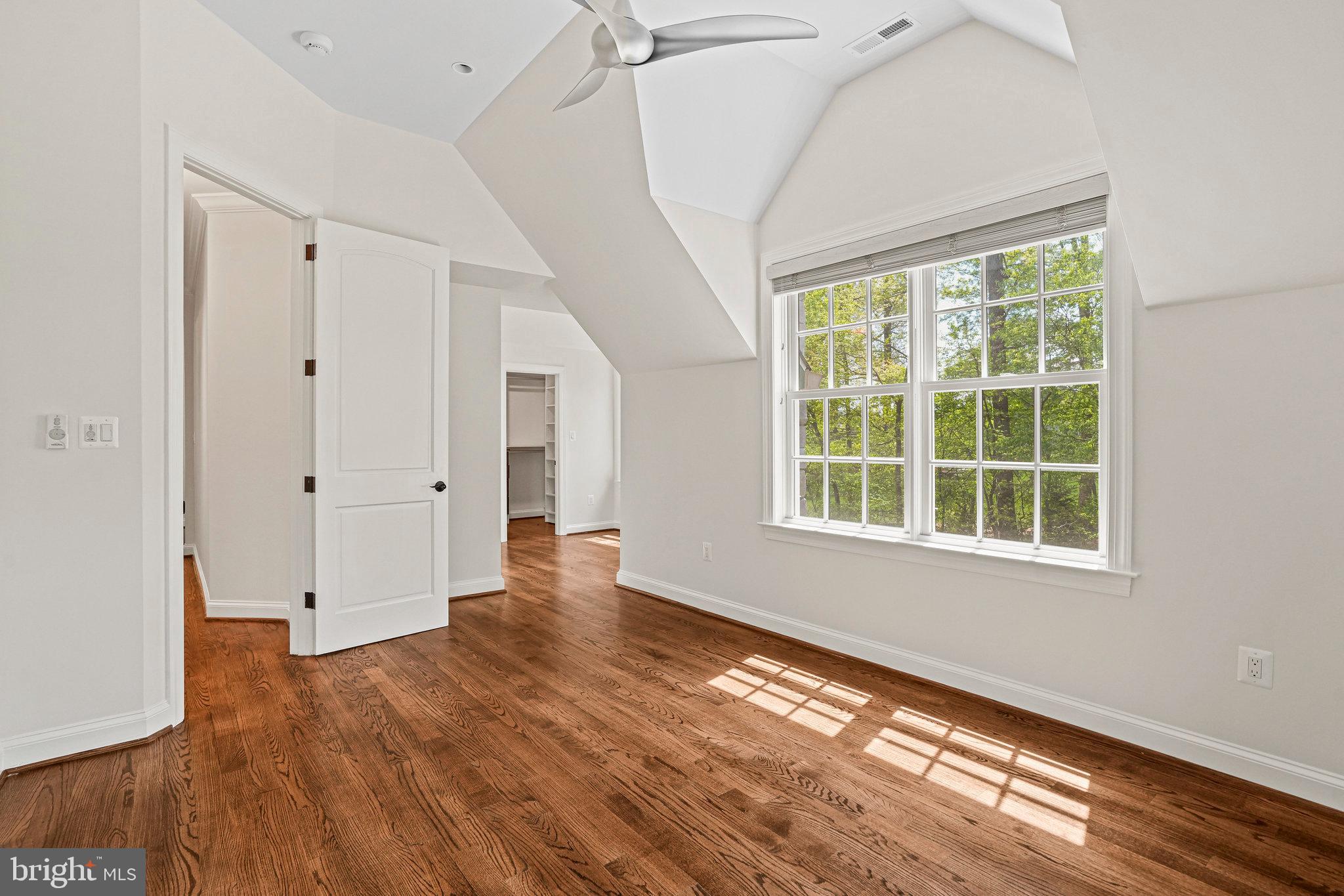 13551 Triadelphia Mill Road Clarksville, MD 21029 - Photo 40 of 74 a view of an empty room with wooden floor and a window