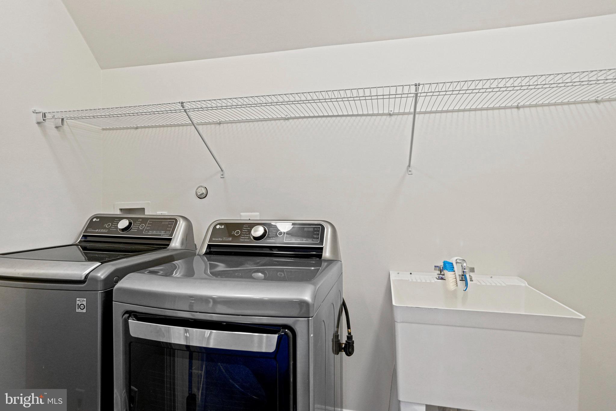 13551 Triadelphia Mill Road Clarksville, MD 21029 - Photo 52 of 74 a utility room with dryer and washer