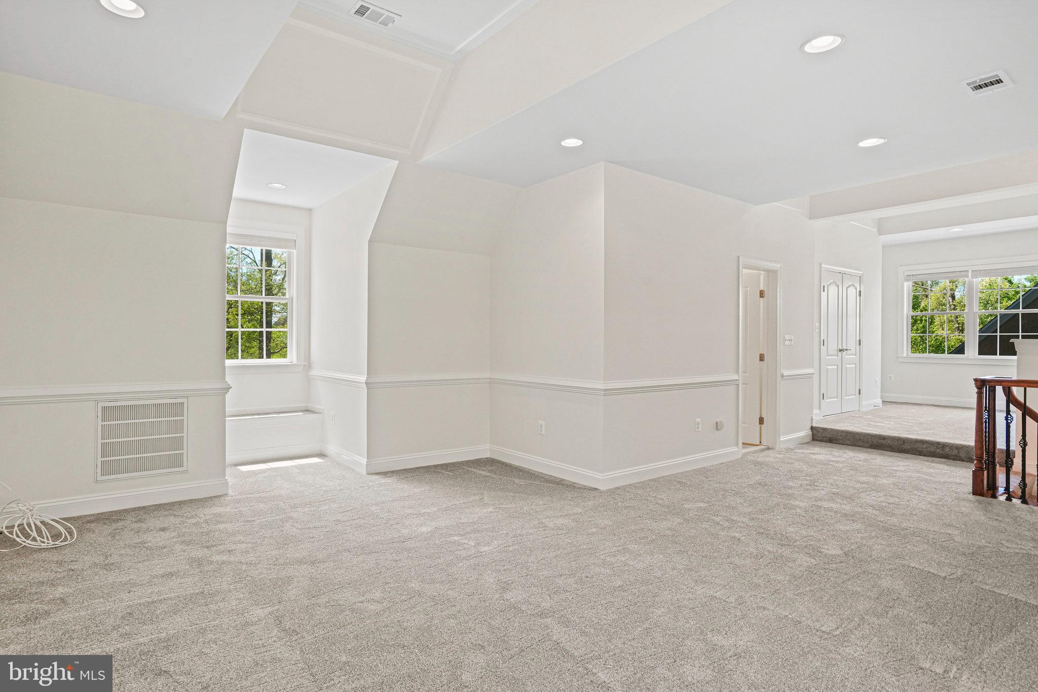 13551 Triadelphia Mill Road Clarksville, MD 21029 - Photo 55 of 74 an empty room with windows and pillars in it