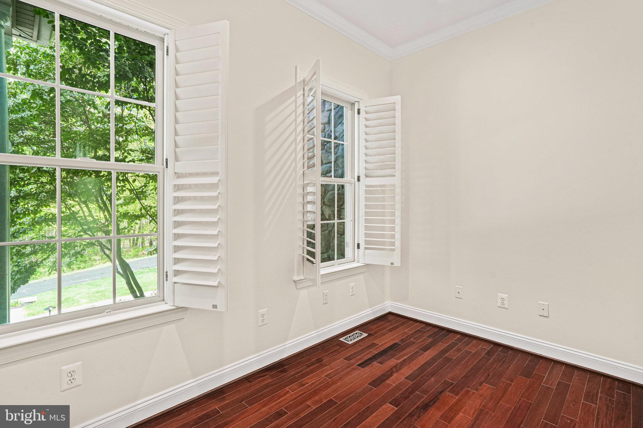 13551 Triadelphia Mill Road Clarksville, MD 21029 - Photo 6 of 74 an empty room with wooden floor and windows
